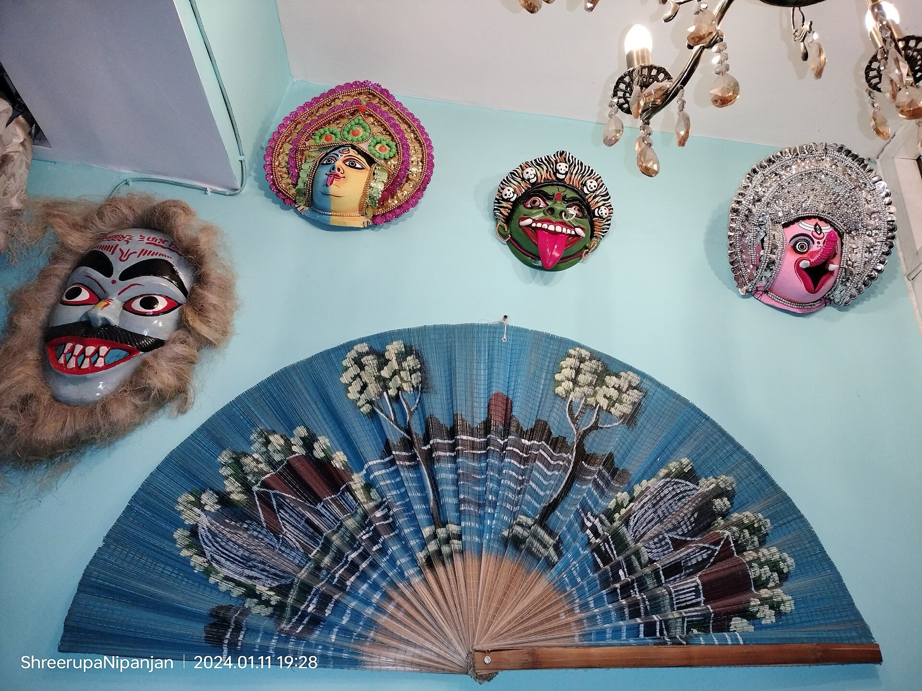 Colorful folk masks displayed as awareness-themed decor
