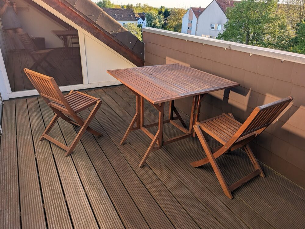 Outdoor dining and lounge furniture set on a patio