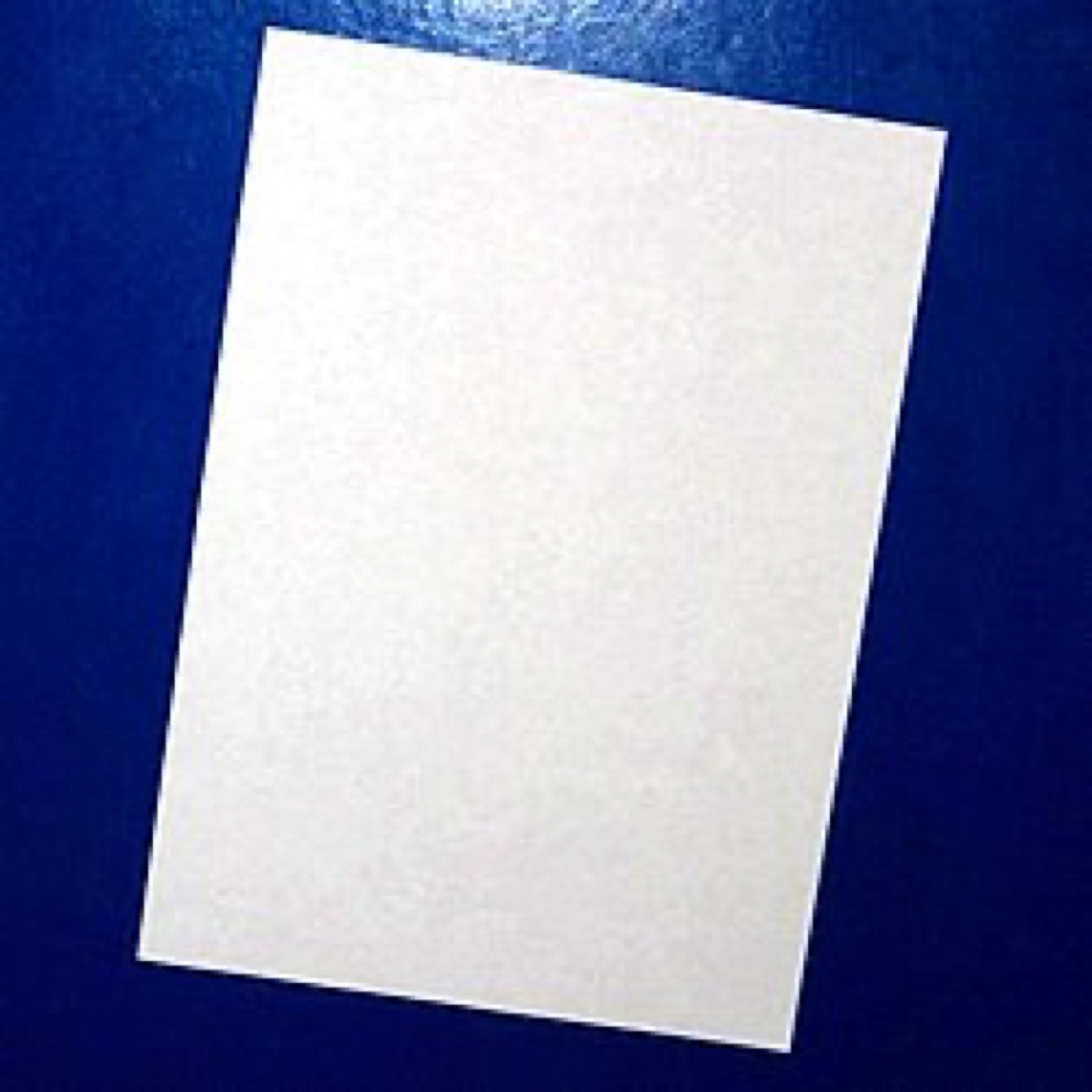 Stack of white paper sheets on a table