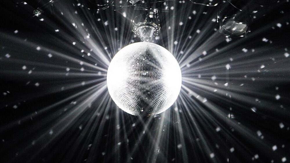 Disco ball decor hanging from ceiling in a diner