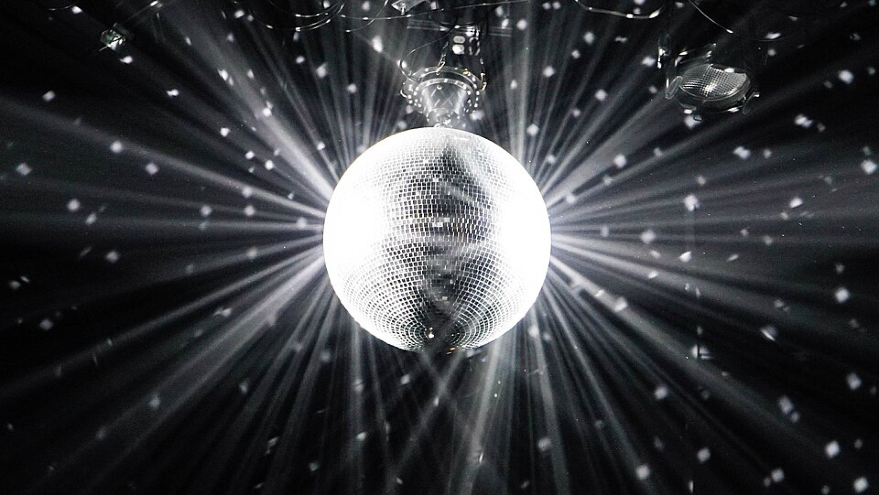 Disco ball decor hanging from ceiling in a diner