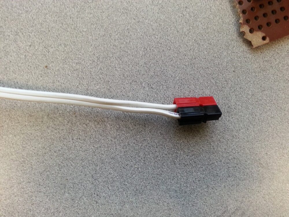 Grey Anderson-style electrical connector used in 12V power systems