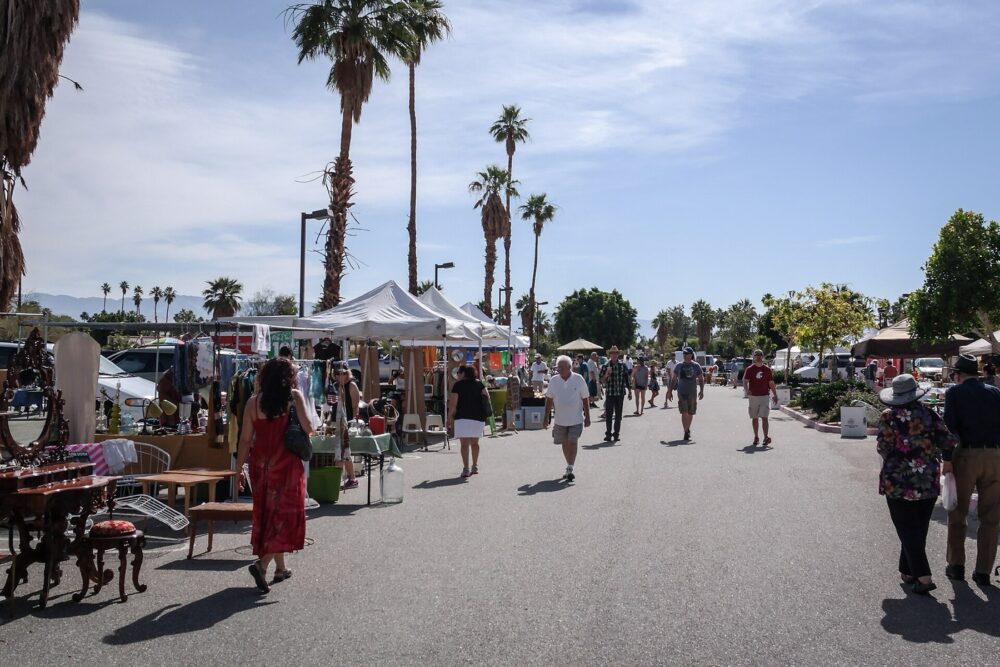 Vintage open-air market stalls with assorted goods, similar to where physical molcajetes might be sourced.