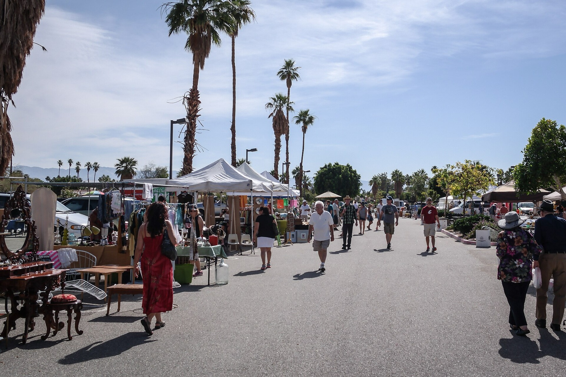 Vintage open-air market stalls with assorted goods, similar to where physical molcajetes might be sourced.