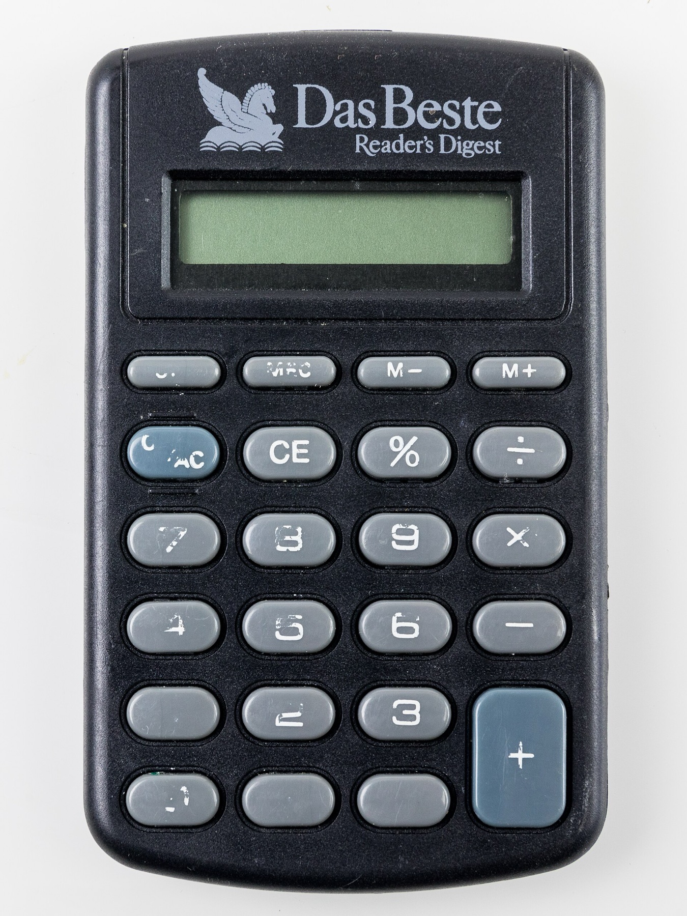 Flat calculator printed with a magazine logo used as a promotional item
