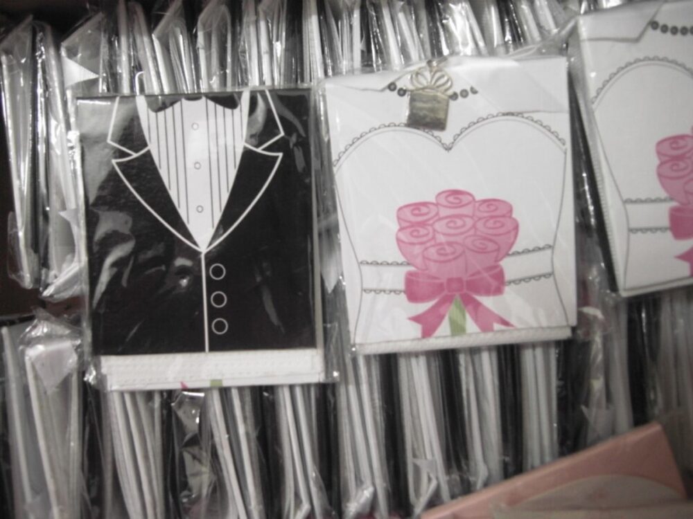 Assorted wedding photo frame favors displayed on a table