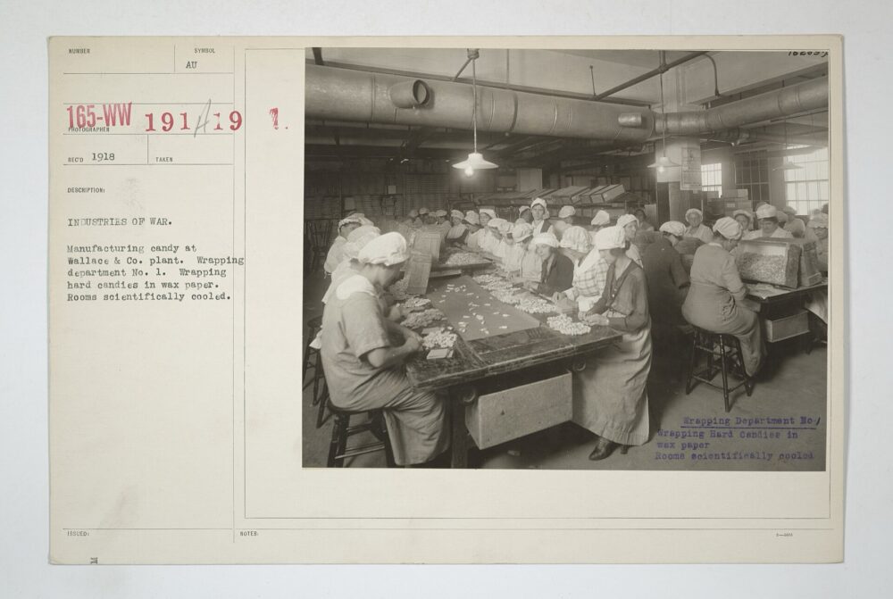 Historic candy wrapping department using wax paper on hard candies