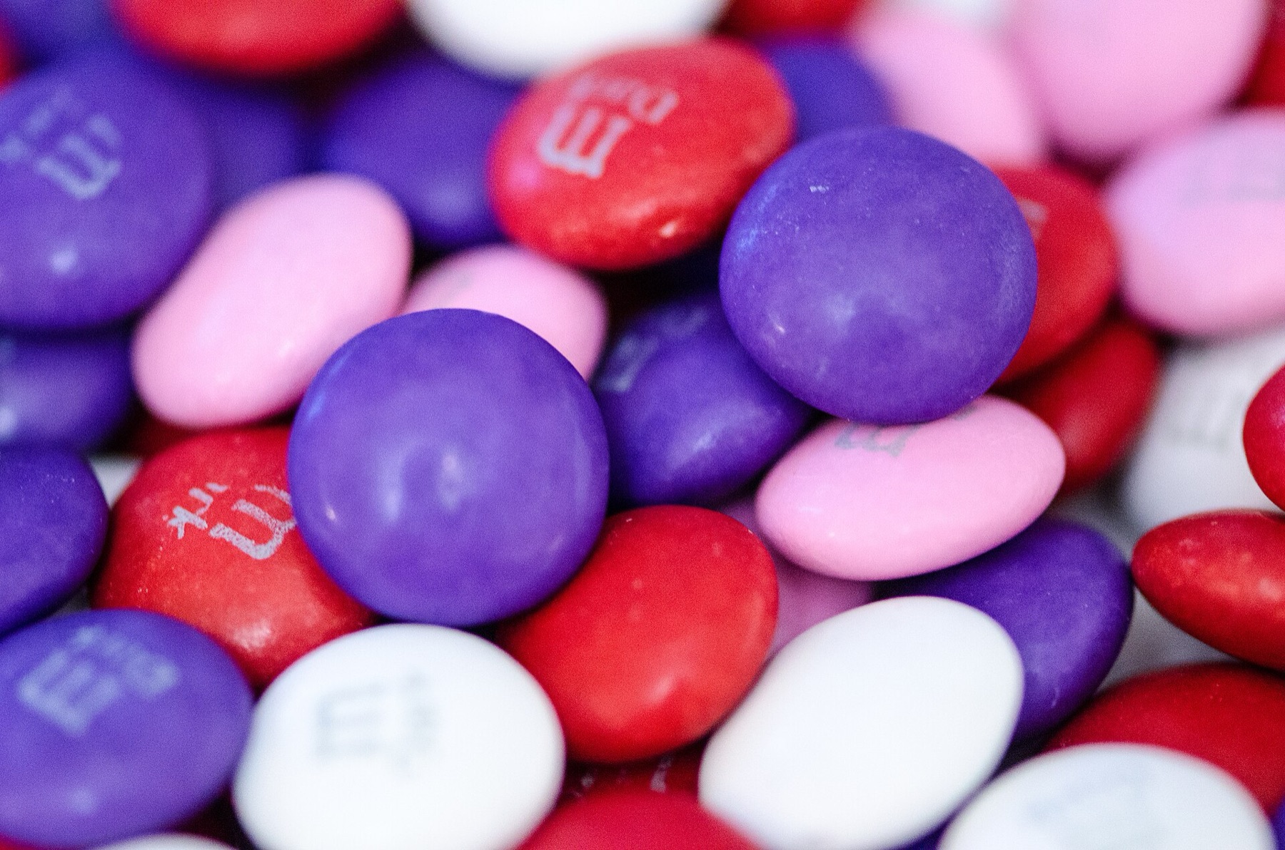 Assorted M&M-style chocolate candies close-up