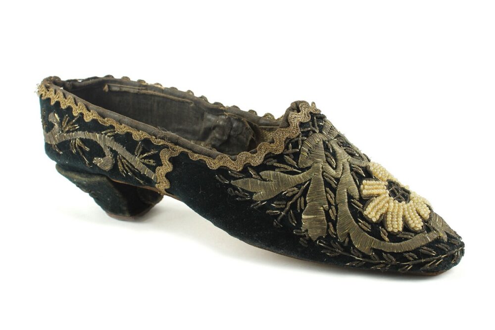 Historic gold-embroidered velvet shoe from a museum collection