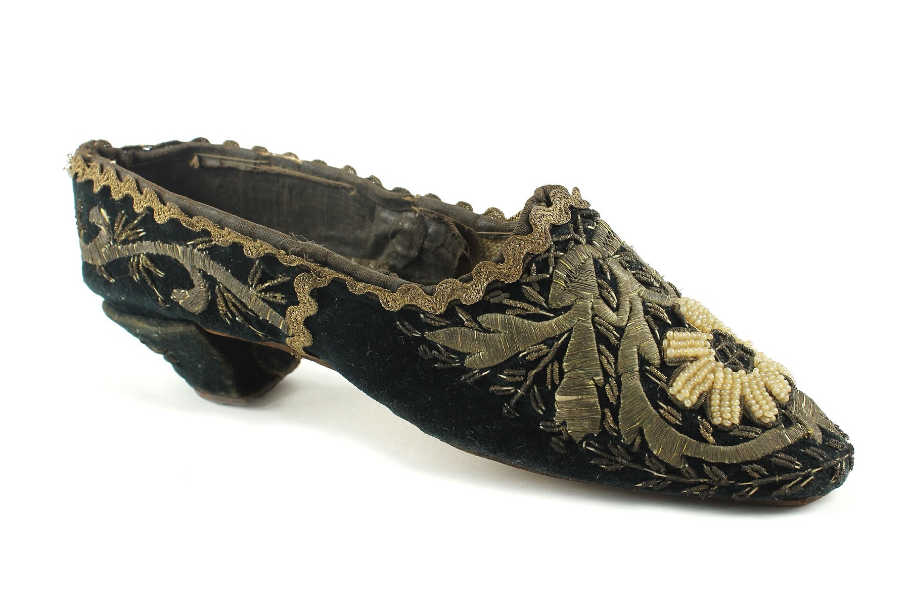 Historic gold-embroidered velvet shoe from a museum collection