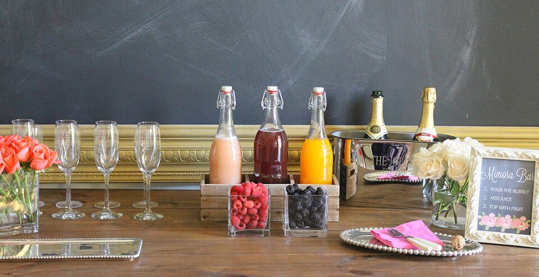 Chalkboard mimosa bar sign used as party drink station decor