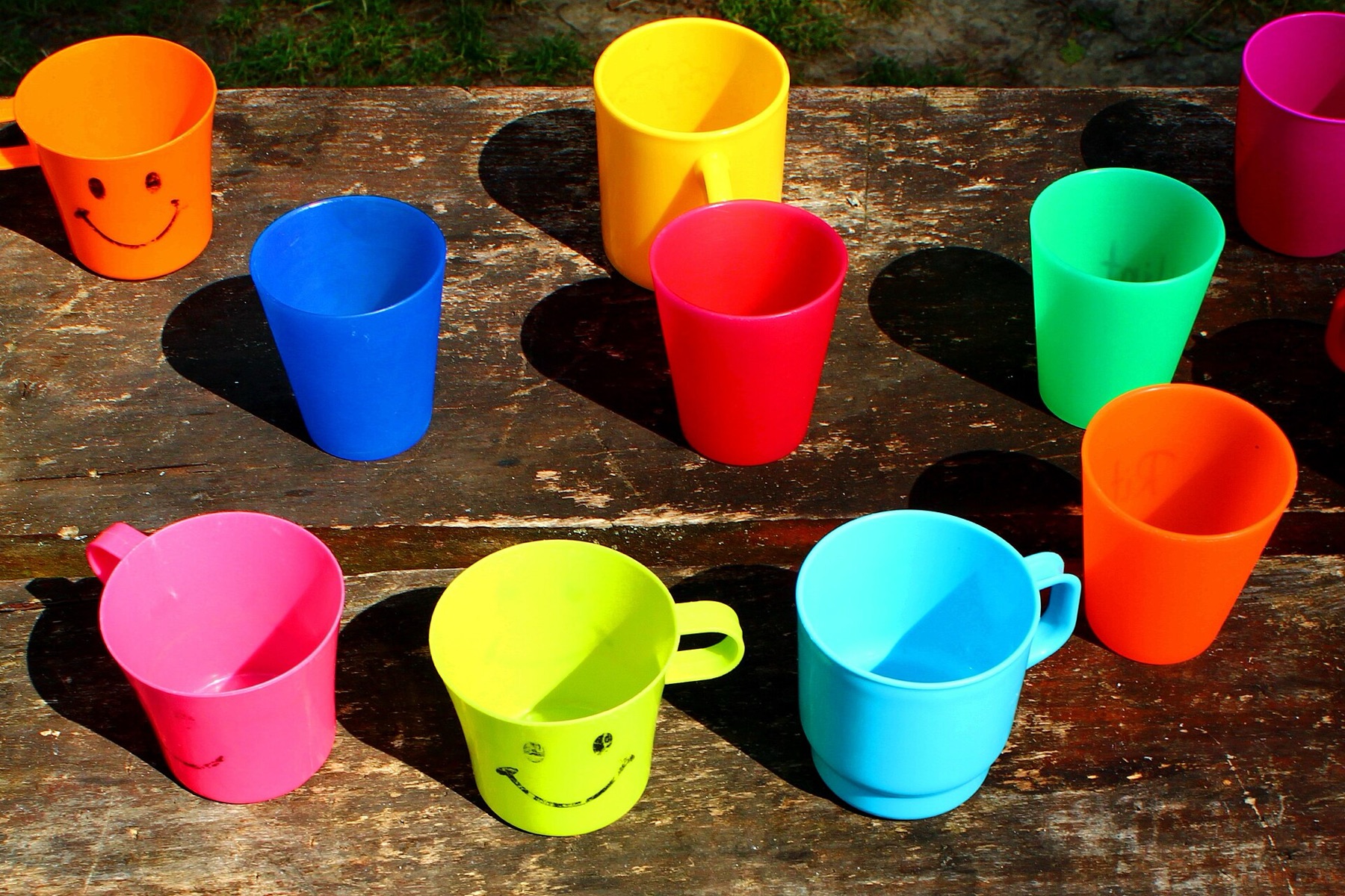 Assorted colorful plastic cups suitable for party drinkware