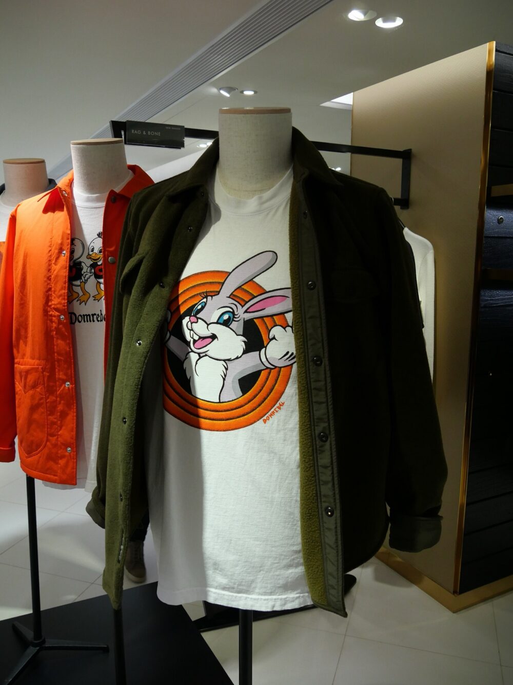 Assorted bunny graphic T-shirts hanging in a shop