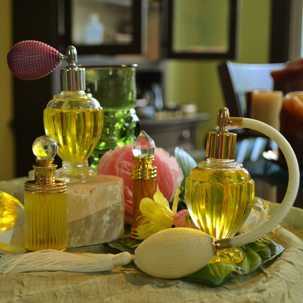 Assorted glass perfume bottles displayed on a shelf