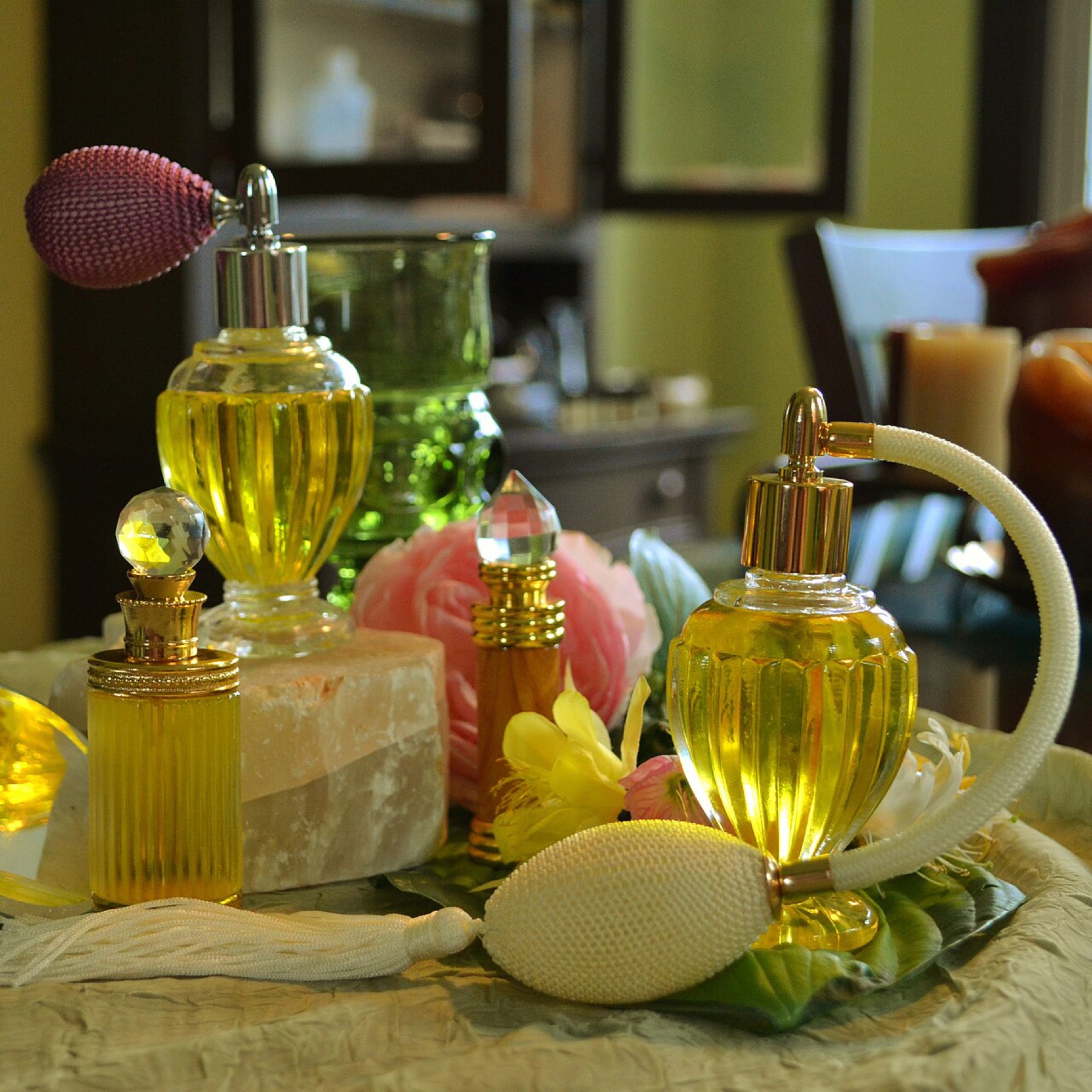 Assorted glass perfume bottles displayed on a shelf