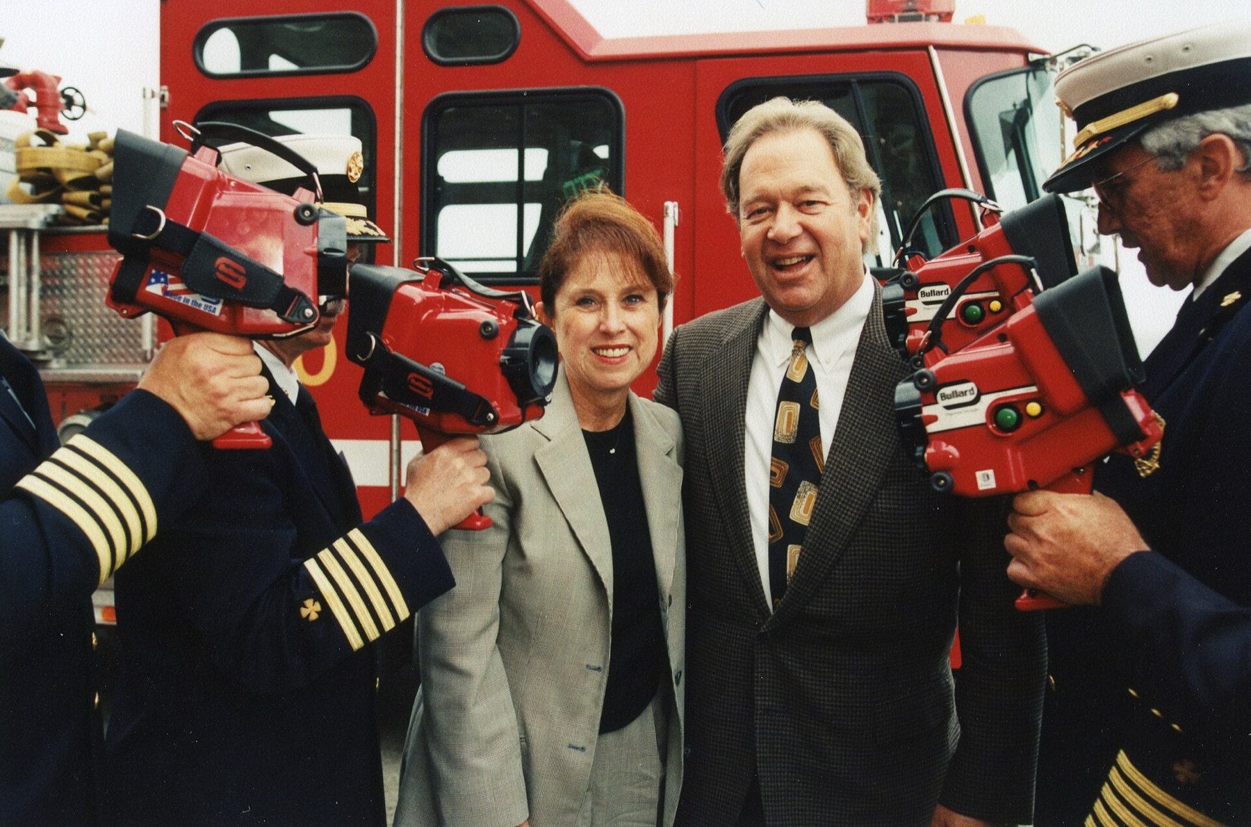 Firefighters using handheld thermal imaging cameras in the field