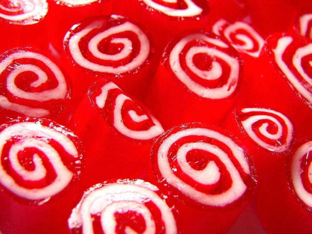 Red and colorful candy pieces in a pile