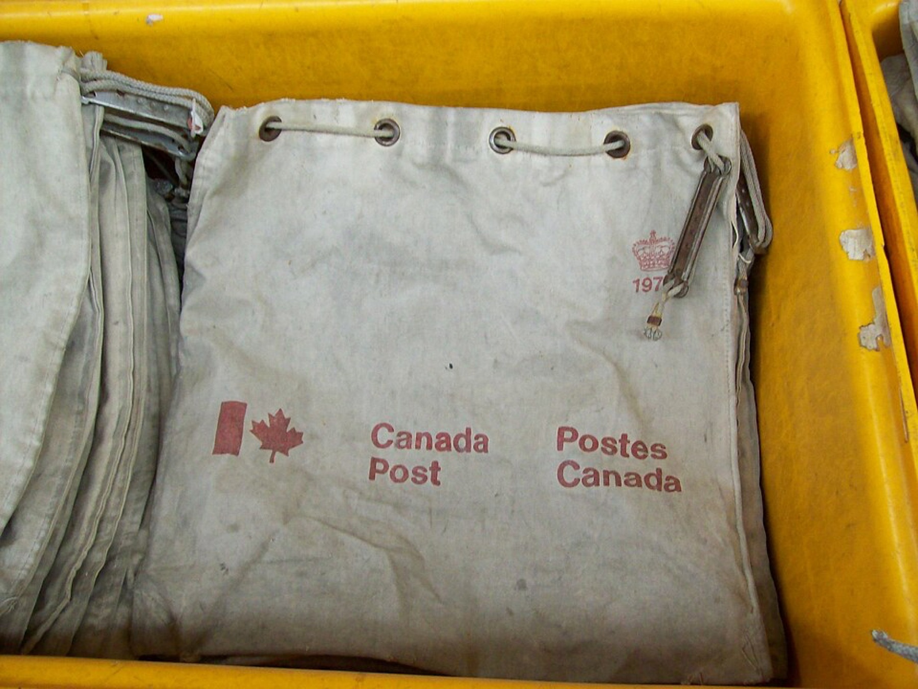 Plain canvas tote bags laid out on a surface