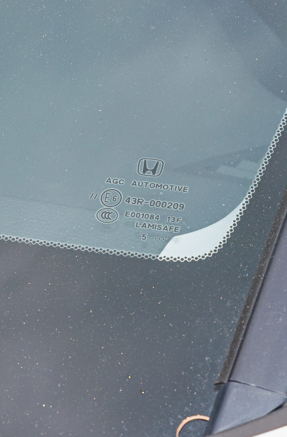 Front view of an SUV windshield, illustrating the large glass area a sunshade must cover