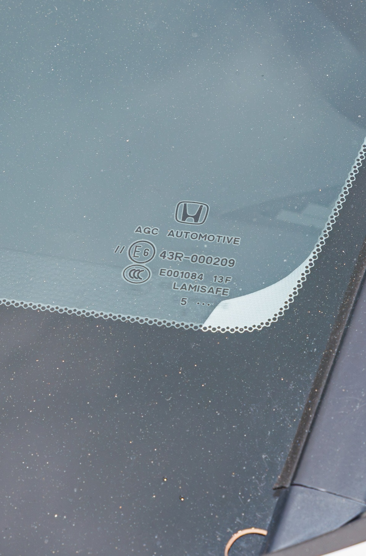 Front view of an SUV windshield, illustrating the large glass area a sunshade must cover