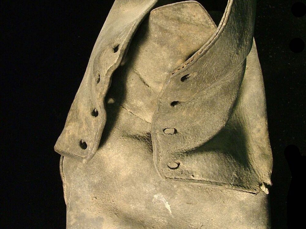 Close-up of shoe lace holes, useful visual for thinking in terms of shoe parts and accessories rather than whole shoes
