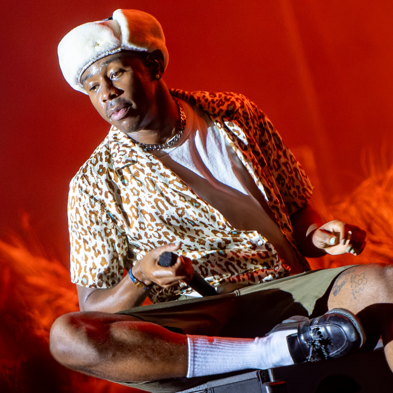 Tyler, the Creator performing on stage, context image for poster aesthetics