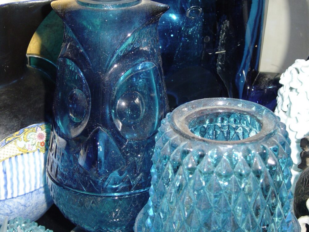 Assorted blue glassware pieces displayed on a table