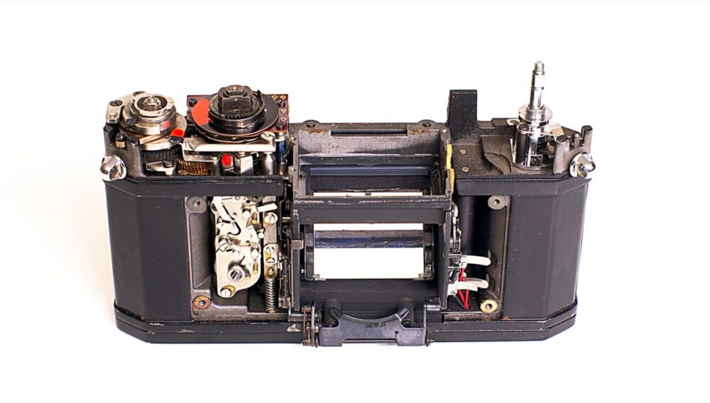 Disassembled Pentax Spotmatic showing internal parts and mechanisms