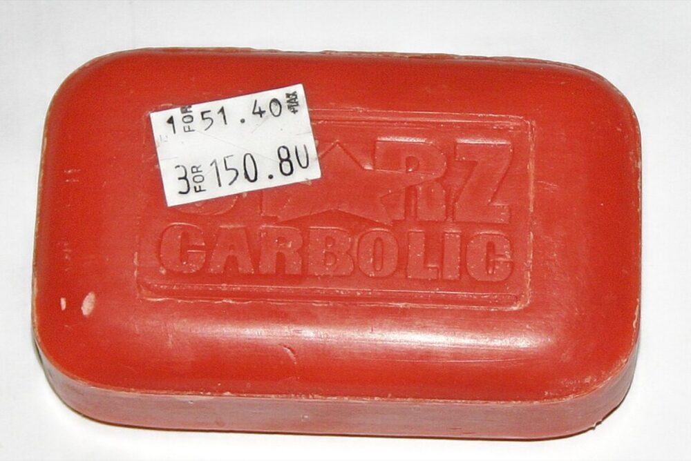 Bar of soap with a small retail price sticker attached, illustrating how simple stickers still carry sourcing costs