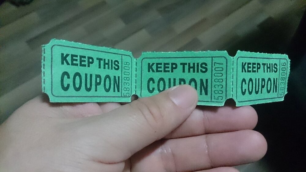 Assorted paper coupons representing stacked discounts