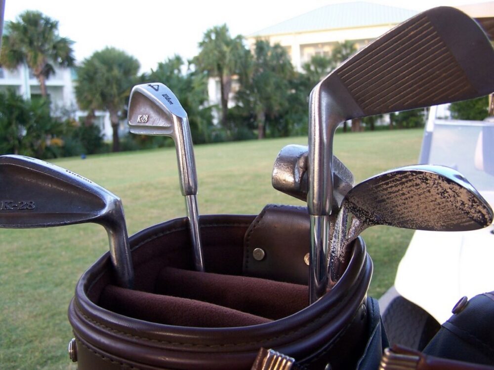 Golf clubs in a bag, with grip ends visible as context for replacement-grip sourcing