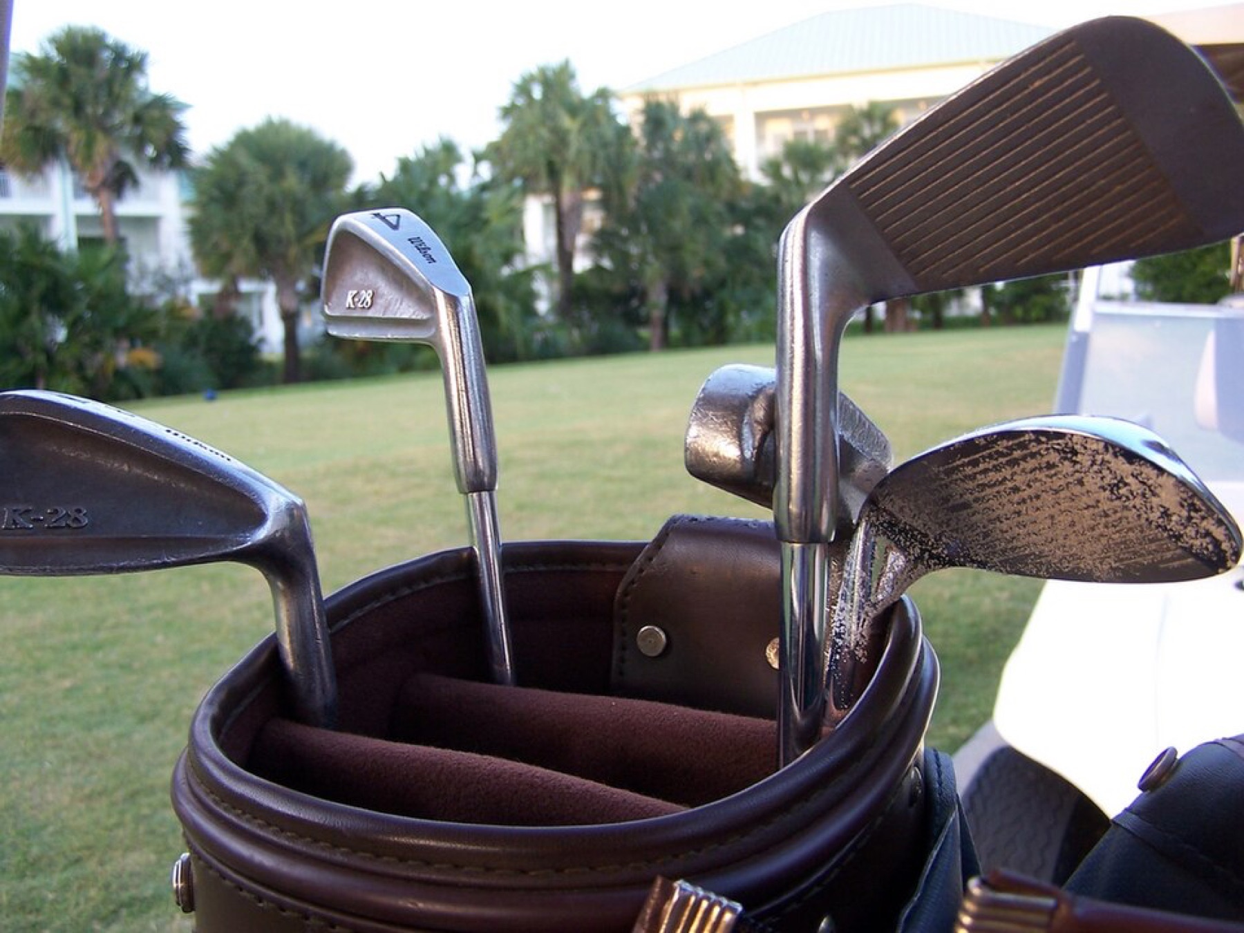 Golf clubs in a bag, with grip ends visible as context for replacement-grip sourcing