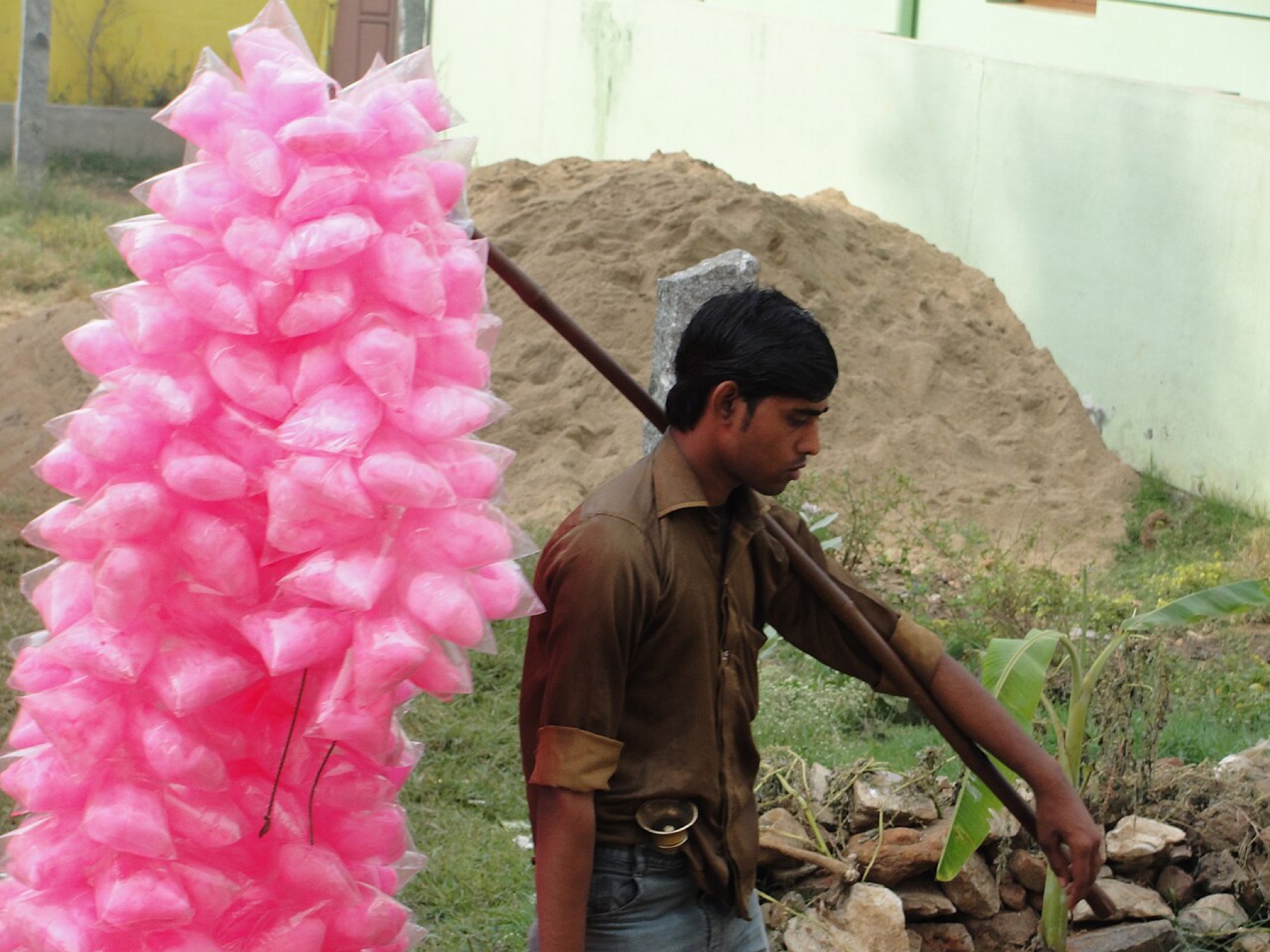 Sugar candy vendor with bulk product on display, illustrating a wholesale-style buying environment