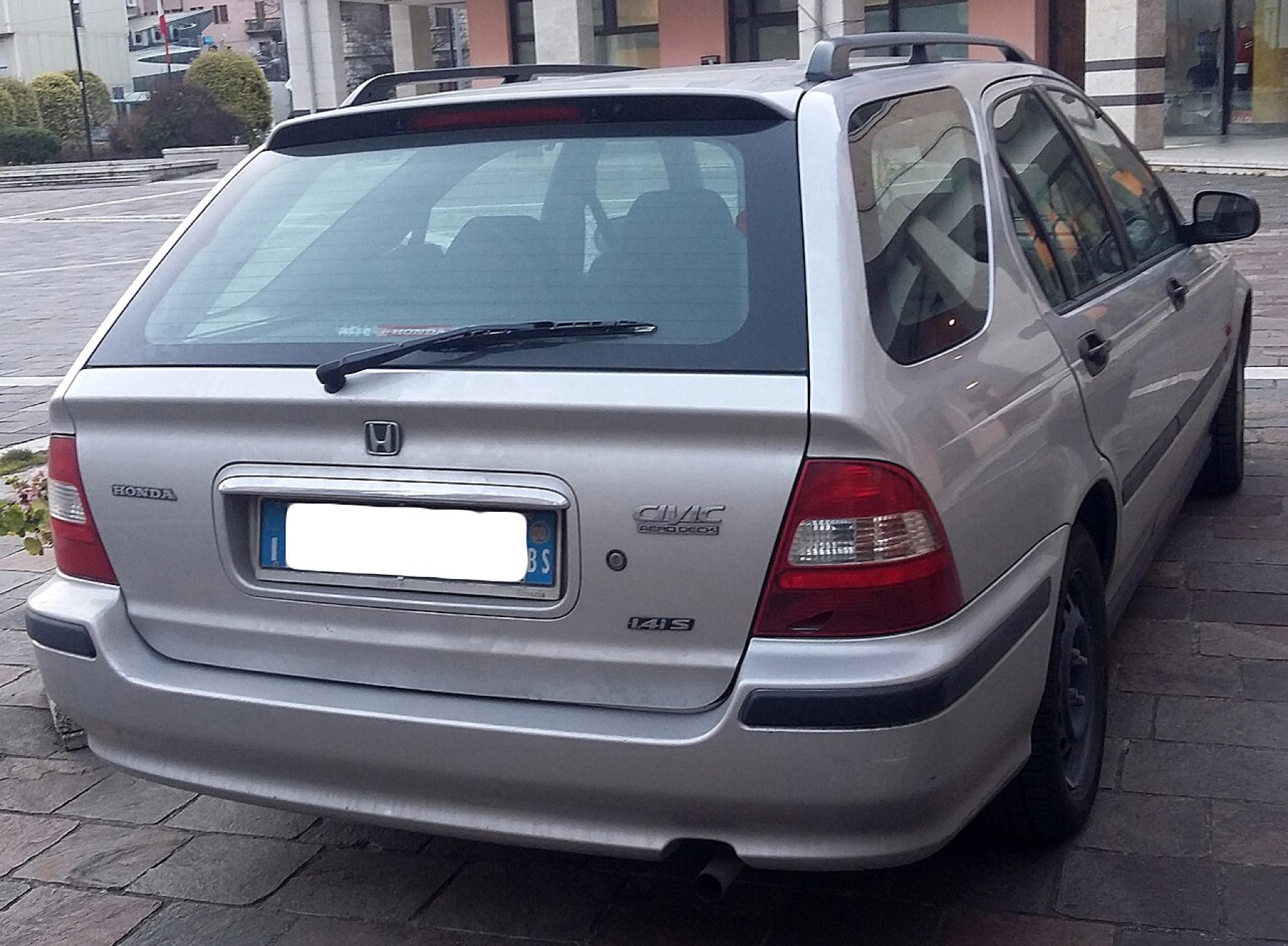 Older Honda Civic rear view showing bumper cover and lighting integration