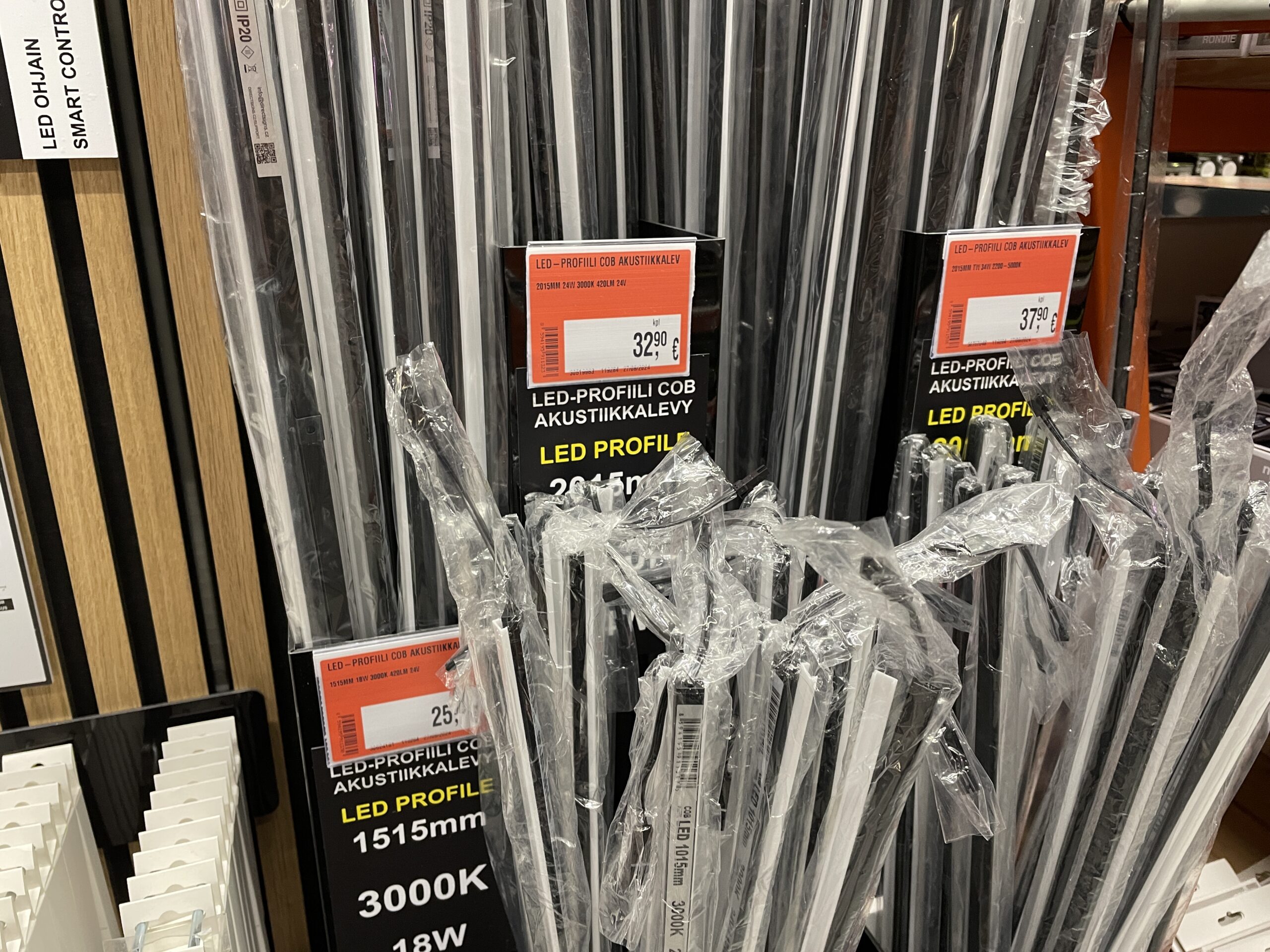 LED strip channels and aluminum profiles displayed in a hardware store