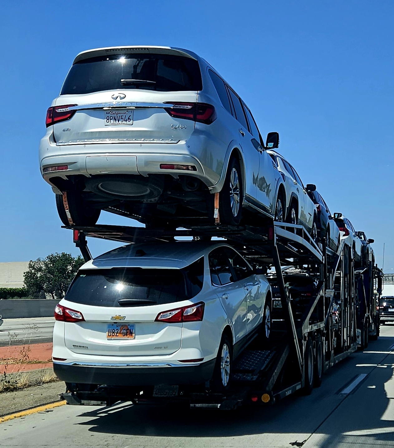 Loaded automobile transport truck carrying vehicles on a highway