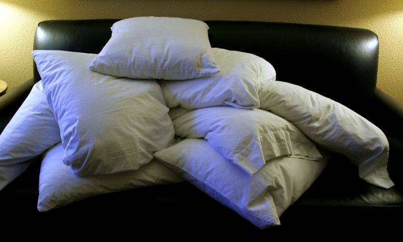 A pile of pillows illustrating the basic product form buyers should compare before evaluating custom printing and seller service