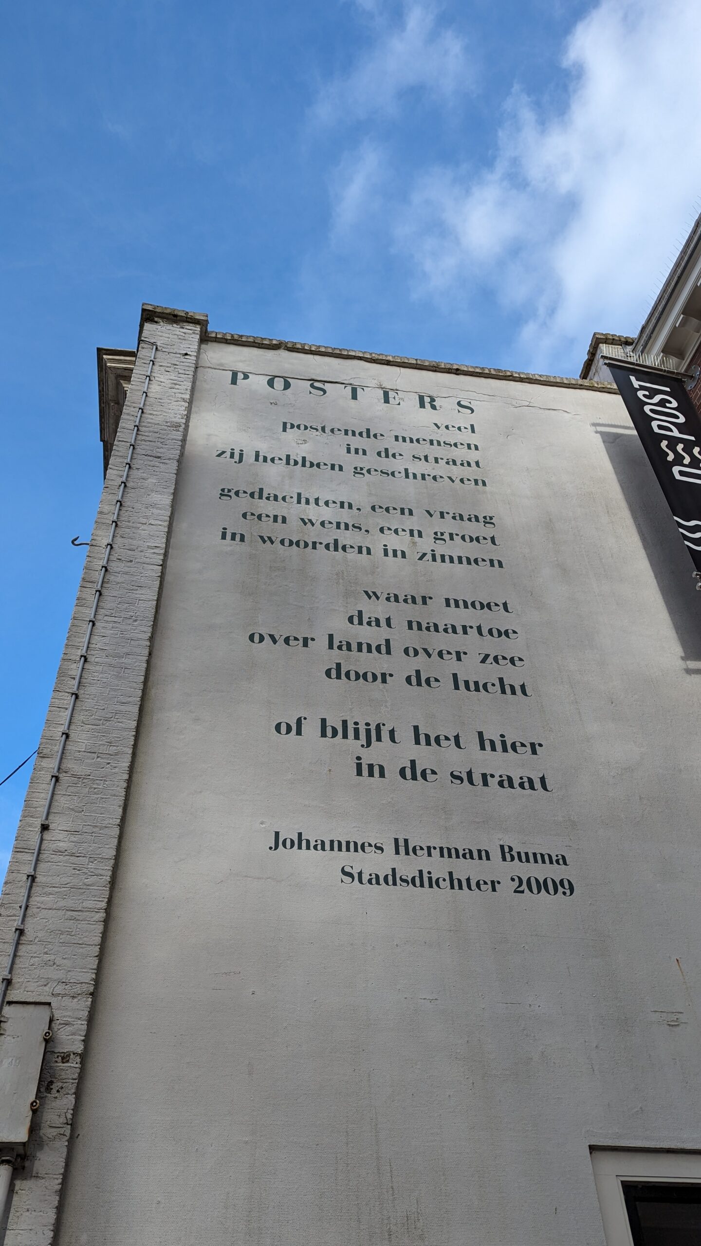 Large-format wall lettering illustrating how viewing distance, scale and typography affect poster choices