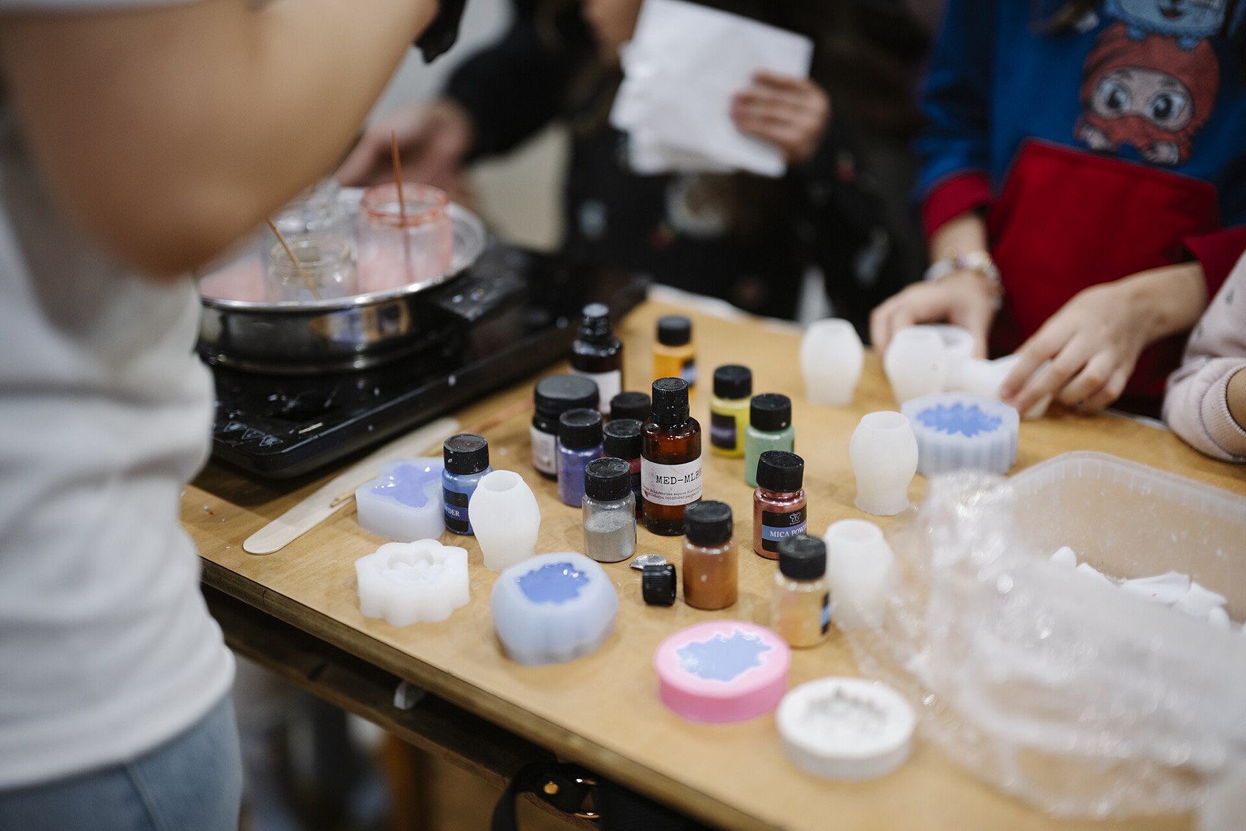 Silicone molds and craft materials at a hands-on soap-making workshop