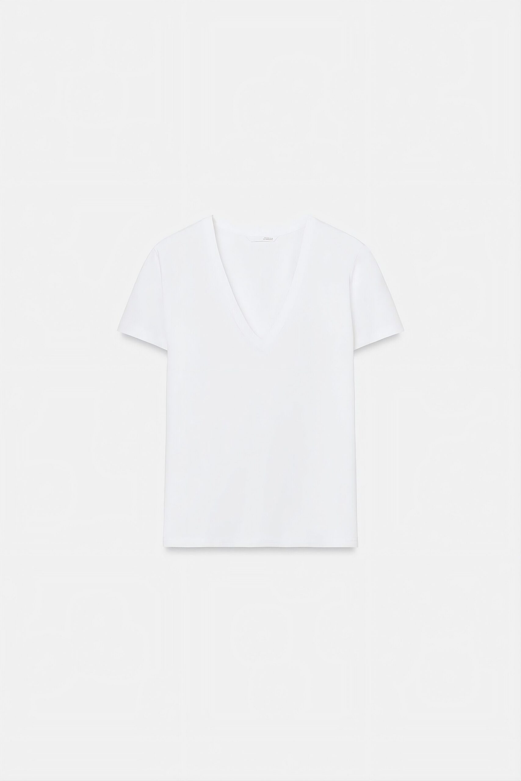 Plain white V-neck T-shirt photographed against a white background
